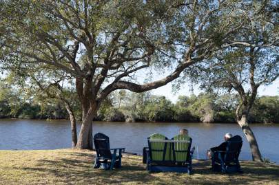 Residents sitting by lake