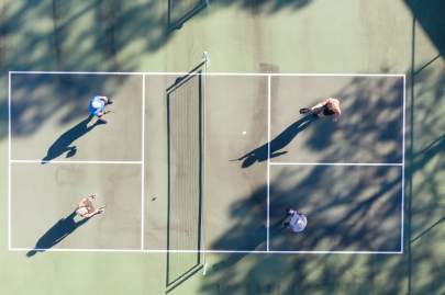Residents playing on tennis court